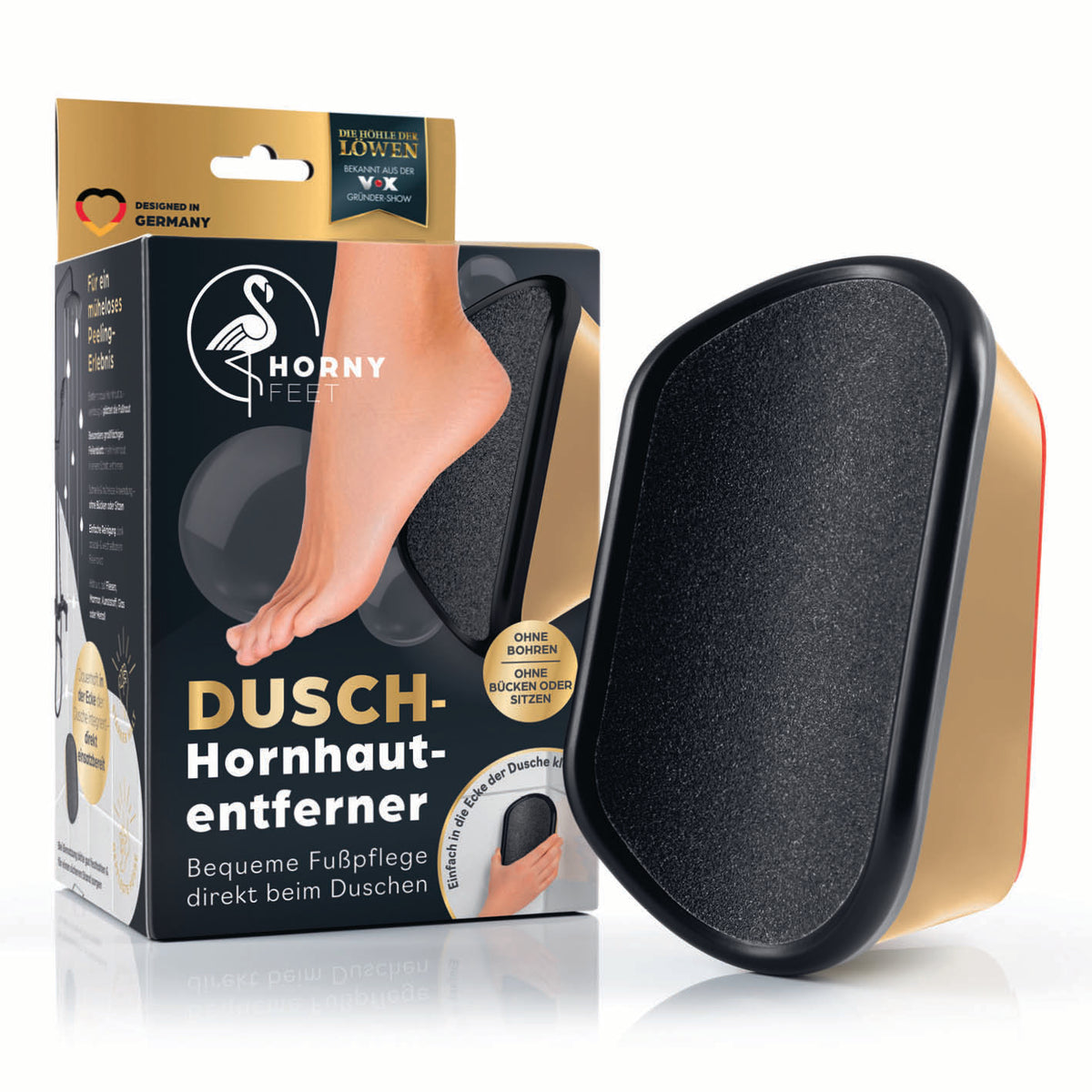 Hornhautentferner für die Dusche - Gold-Edition in Schwarz und Gold neben Verpackung für gepflegte Füße
