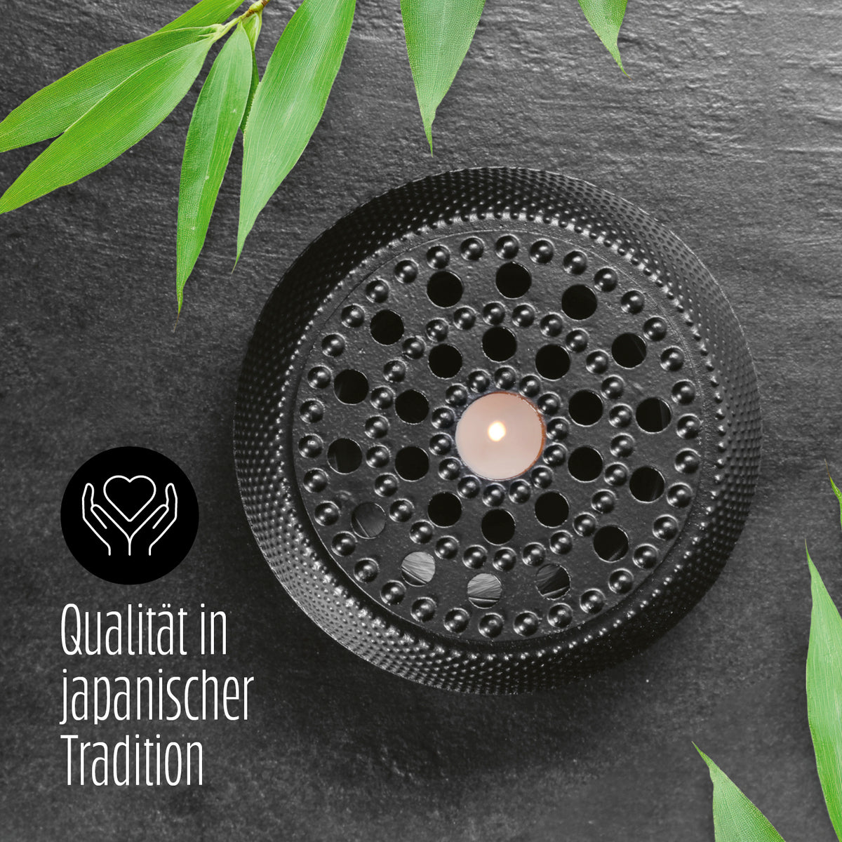 Stövchen aus Gusseisen - Teewärmer für Teekannen – Schwarz mit feuerfester Beschichtung, stilvolles Accessoire nach asiatischer Tradition.