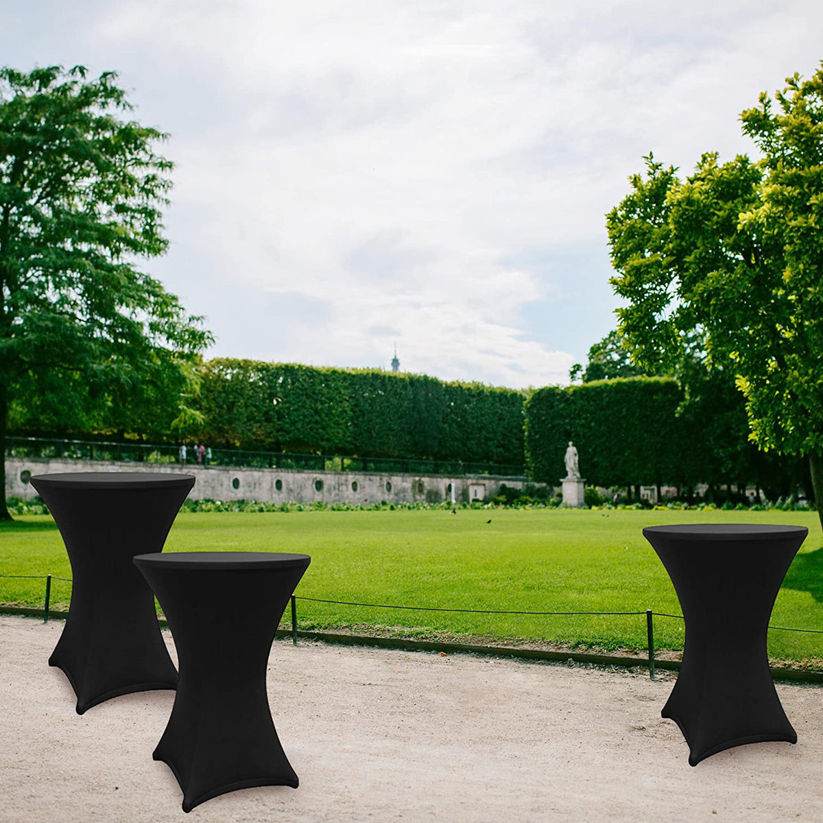 Stehtischhusse - Tisch Bezug - Husse - Ø 80-85 cm - Schwarz - 5er-Set auf Stehtischen in Parkumgebung, elegante Passform und Materialqualität.