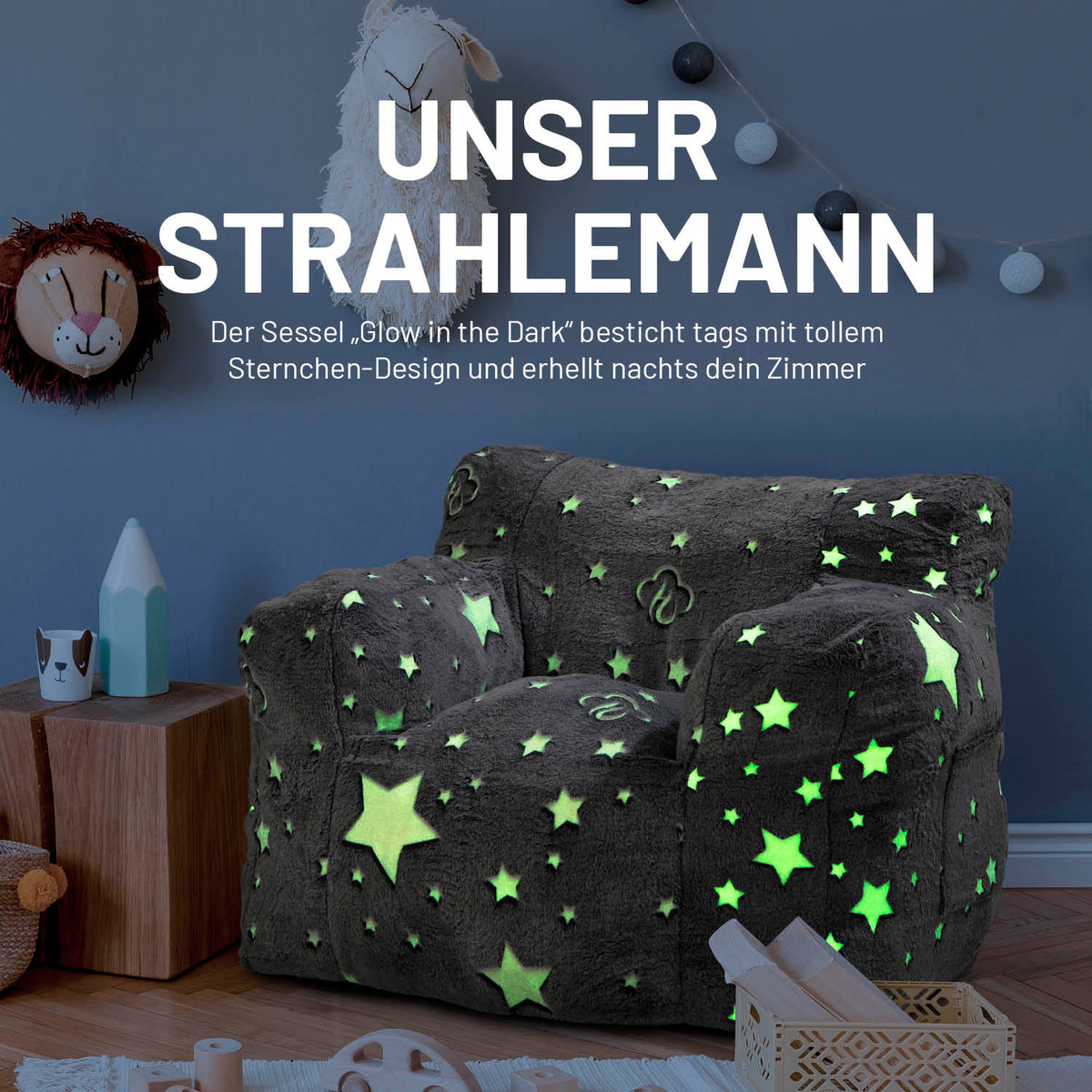 Sessel „Glow in the Dark“ - Grau mit leuchtendem Sternen-Design, weich und kuschelig für gemütliche Momente im Kinderzimmer.